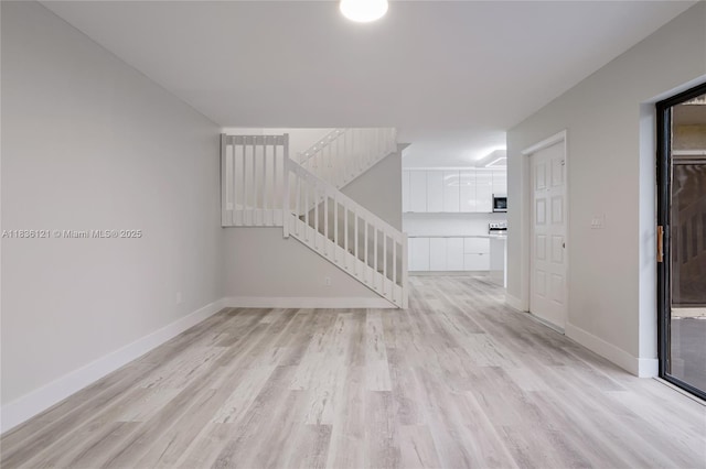 1170 SW 118th Ter, Davie, FL 33325 - spare room featuring light wood-style floors and stairway