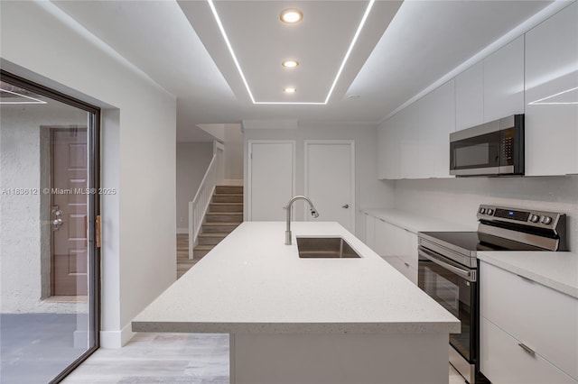 1170 SW 118th Ter, Davie, FL 33325 - kitchen featuring stainless steel appliances, white cabinetry, modern cabinets, and recessed lighting