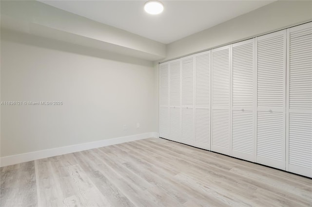 1170 SW 118th Ter, Davie, FL 33325 - unfurnished bedroom with light wood-style flooring and a closet