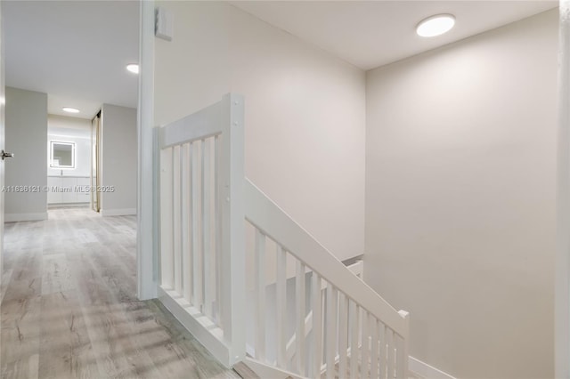 1170 SW 118th Ter, Davie, FL 33325 - hallway featuring an upstairs landing and wood finished floors