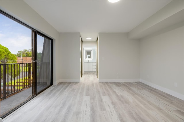 1170 SW 118th Ter, Davie, FL 33325 - unfurnished room with light wood finished floors and baseboards