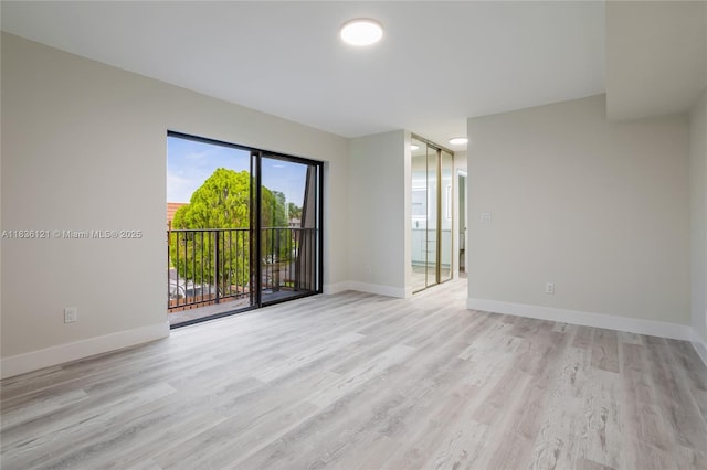 1170 SW 118th Ter, Davie, FL 33325 - unfurnished room with light wood-style floors and baseboards