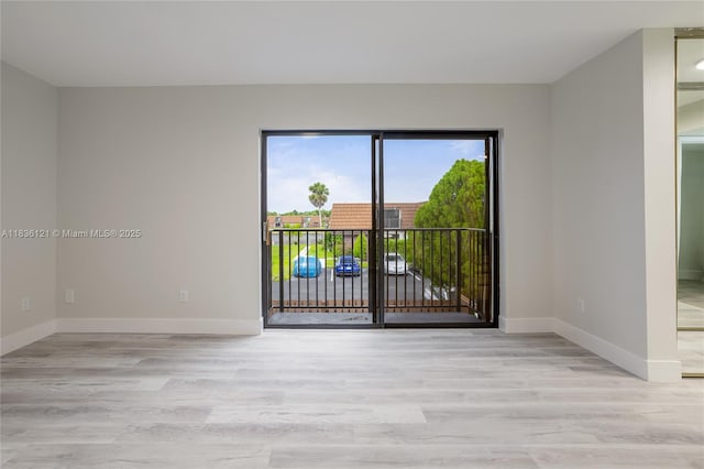 1170 SW 118th Ter, Davie, FL 33325 - spare room featuring wood finished floors and baseboards