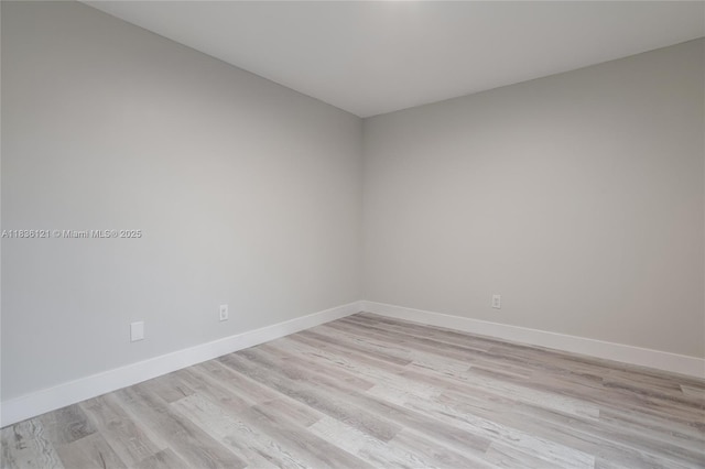 1170 SW 118th Ter, Davie, FL 33325 - empty room with light wood finished floors and baseboards