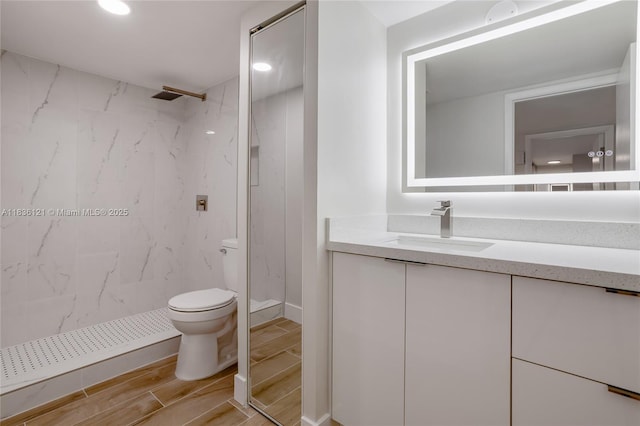 1170 SW 118th Ter, Davie, FL 33325 - bathroom with vanity, wood finish floors, a marble finish shower, and recessed lighting