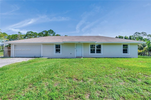 15859 N 68th Ct N, Loxahatchee, FL 33470 - ranch-style home featuring driveway, stucco siding, a front lawn, and a garage