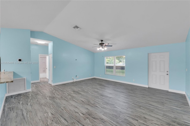 15859 N 68th Ct N, Loxahatchee, FL 33470 - unfurnished living room with a ceiling fan, wood finished floors, and lofted ceiling