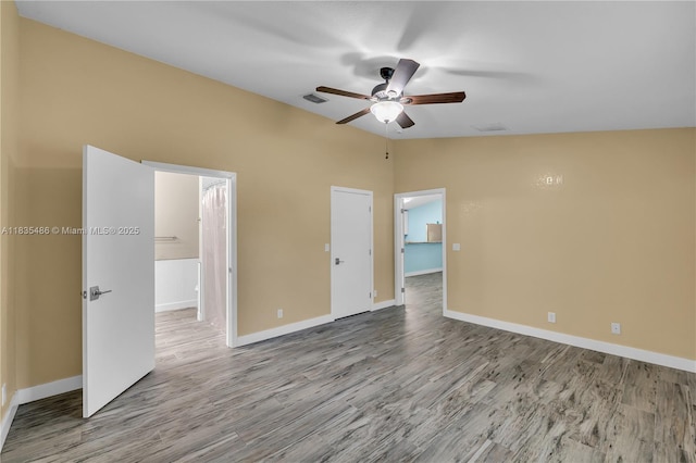 15859 N 68th Ct N, Loxahatchee, FL 33470 - spare room featuring ceiling fan, wood finished floors, and vaulted ceiling
