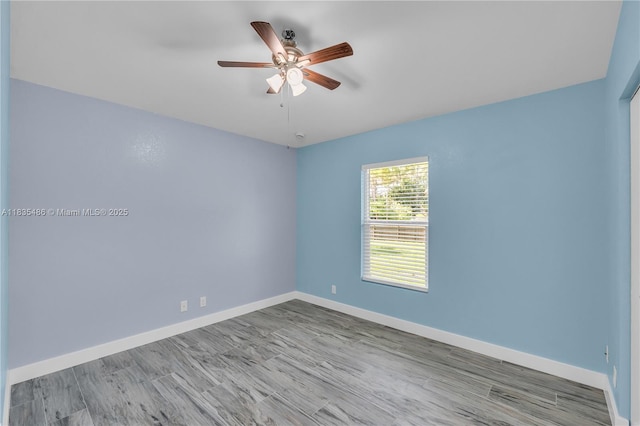 15859 N 68th Ct N, Loxahatchee, FL 33470 - empty room featuring ceiling fan and wood finished floors