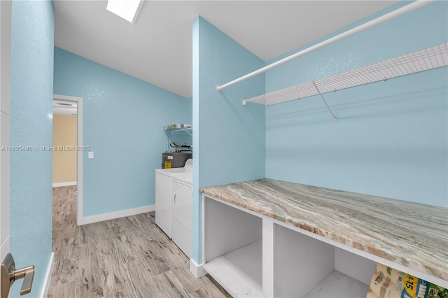15859 N 68th Ct N, Loxahatchee, FL 33470 - laundry area with light wood-type flooring, water heater, and washer and dryer