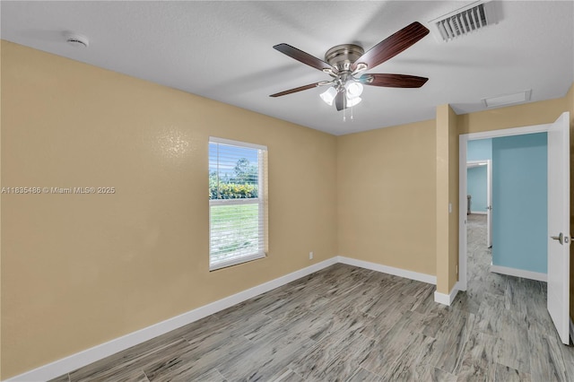 15859 N 68th Ct N, Loxahatchee, FL 33470 - empty room with wood finished floors and ceiling fan