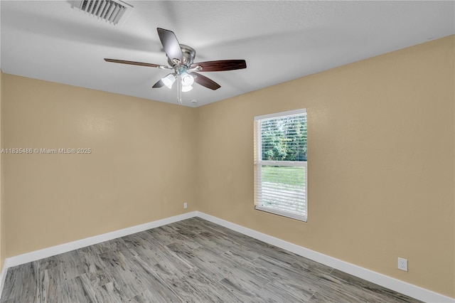 15859 N 68th Ct N, Loxahatchee, FL 33470 - spare room featuring wood finished floors and a ceiling fan