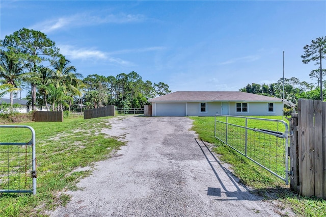 15859 N 68th Ct N, Loxahatchee, FL 33470 - ranch-style home featuring a garage, driveway, and a gate