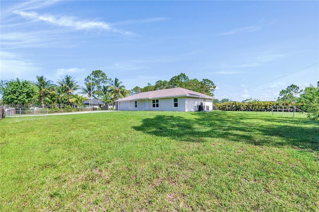 15859 N 68th Ct N, Loxahatchee, FL 33470 - view of green lawn featuring a garage