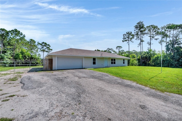 15859 N 68th Ct N, Loxahatchee, FL 33470 - view of front of house with a garage and driveway