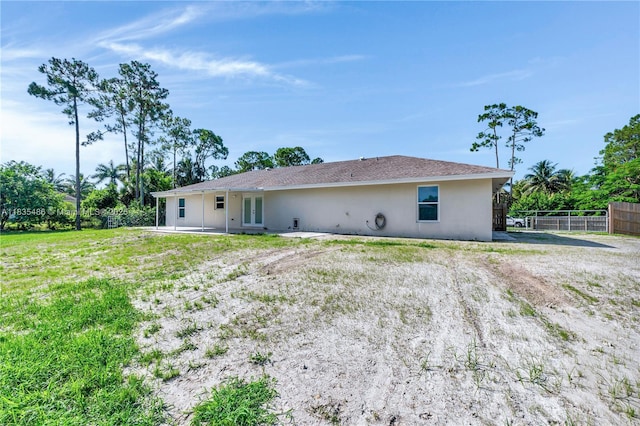 15859 N 68th Ct N, Loxahatchee, FL 33470 - rear view of property featuring stucco siding