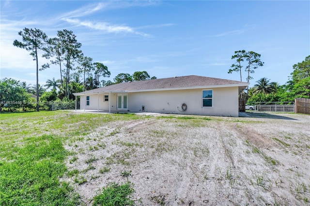 15859 N 68th Ct N, Loxahatchee, FL 33470 - rear view of property with french doors, stucco siding, and a patio area