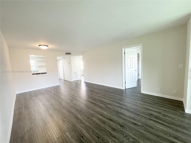9750 Sunrise Lakes Blvd Unit 109, Sunrise, FL 33322 - unfurnished living room featuring dark wood finished floors