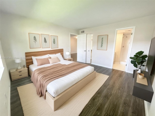9750 Sunrise Lakes Blvd Unit 109, Sunrise, FL 33322 - bedroom featuring dark wood-style floors and ensuite bathroom