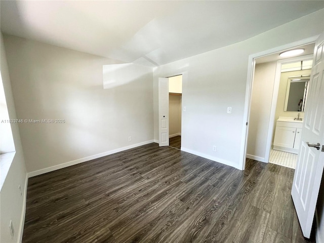 9750 Sunrise Lakes Blvd Unit 109, Sunrise, FL 33322 - unfurnished room with dark wood-style flooring and baseboards