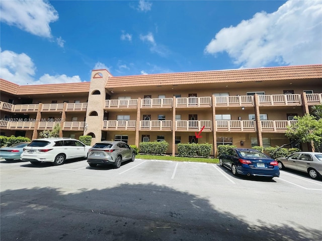 9750 Sunrise Lakes Blvd Unit 109, Sunrise, FL 33322 - view of apartment building / complex with uncovered parking