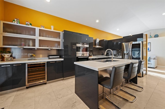 17476 SW 20th St, Miramar, FL 33029 - kitchen with wine cooler, lofted ceiling, light countertops, appliances with stainless steel finishes, and a breakfast bar area