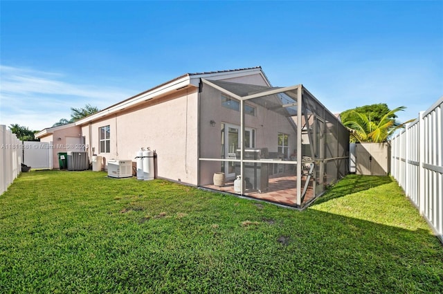 17476 SW 20th St, Miramar, FL 33029 - rear view of property with a fenced backyard, stucco siding, a lanai, and a patio