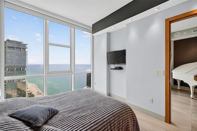 18201 Collins Ave Unit Ts2 & Ts3, Sunny Isles Beach, FL 33160 - bedroom with baseboards and expansive windows