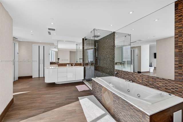 18201 Collins Ave Unit Ts2 & Ts3, Sunny Isles Beach, FL 33160 - full bath featuring a shower stall, vanity, a tub with jets, wood finished floors, and recessed lighting