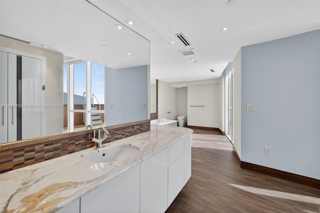 18201 Collins Ave Unit Ts2 & Ts3, Sunny Isles Beach, FL 33160 - full bathroom featuring vanity, wood finished floors, and recessed lighting