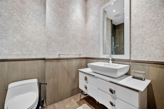 18201 Collins Ave Unit Ts2 & Ts3, Sunny Isles Beach, FL 33160 - bathroom featuring wallpapered walls, wainscoting, and vanity