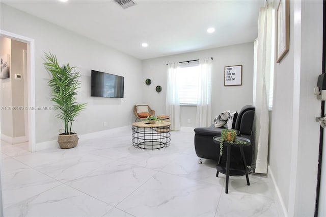 1226 NW 103rd St, Miami, FL 33147 - living area featuring marble look tiles and recessed lighting