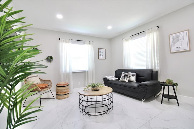 1226 NW 103rd St, Miami, FL 33147 - living area with marble look tile flooring, plenty of natural light, and recessed lighting