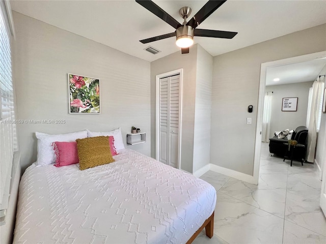 1226 NW 103rd St, Miami, FL 33147 - bedroom with light marble finish flooring, a closet, and ceiling fan
