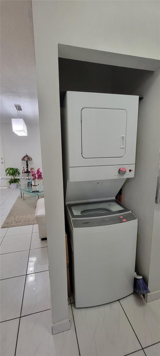 7121 SW 129th Ave Unit 5, Miami, FL 33183 - laundry room featuring stacked washing machine and dryer