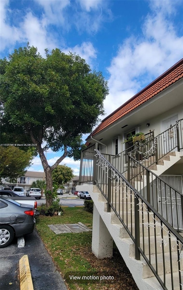 7121 SW 129th Ave Unit 5, Miami, FL 33183 - view of home's exterior with a tiled roof and stairs