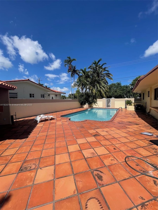 5550 SW 87th Ave, Miami, FL 33165 - view of swimming pool featuring a fenced backyard and a patio area