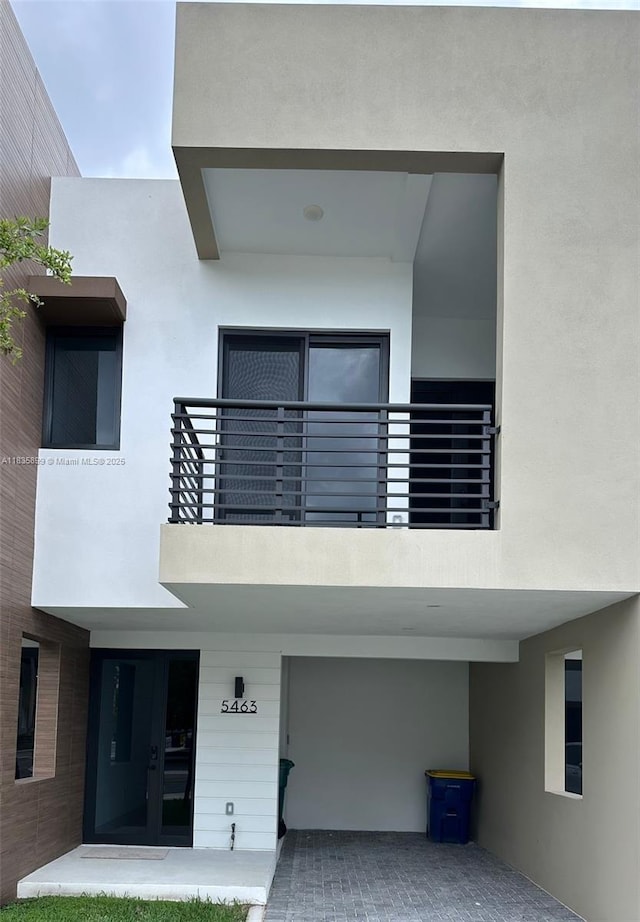 5463 W Oak Way, Dania Beach, FL 33314 - view of front of property featuring stucco siding, a balcony, and french doors