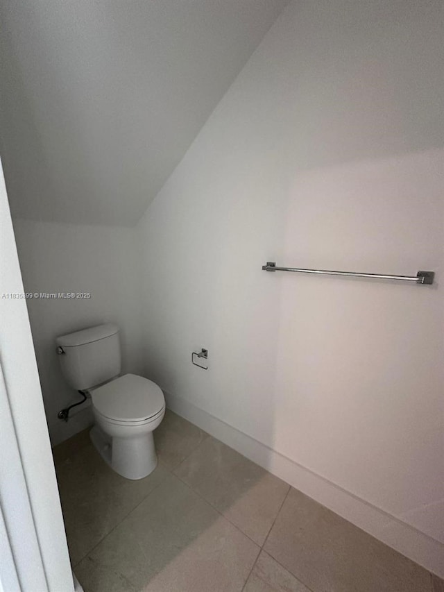 5463 W Oak Way, Dania Beach, FL 33314 - bathroom with lofted ceiling and tile patterned floors