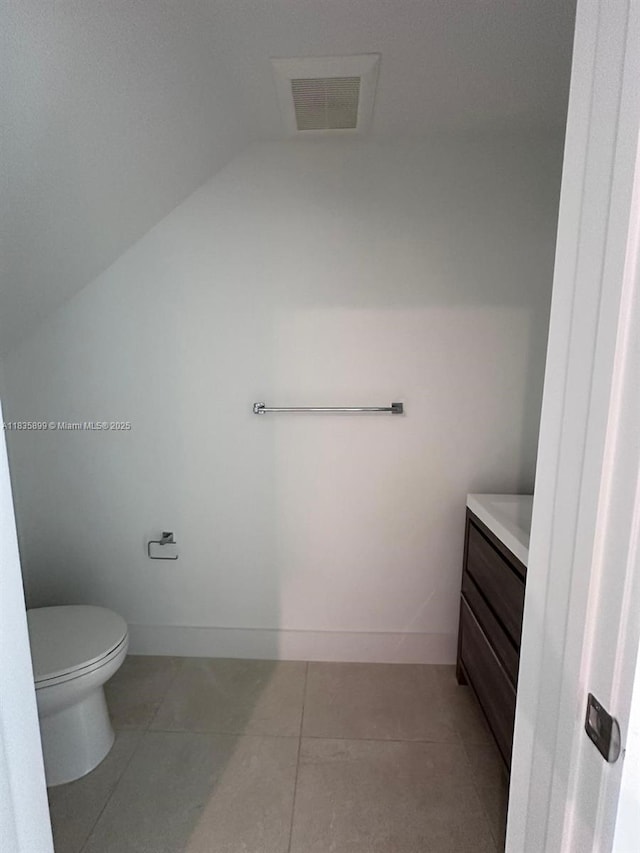 5463 W Oak Way, Dania Beach, FL 33314 - bathroom featuring vanity, lofted ceiling, and tile patterned flooring