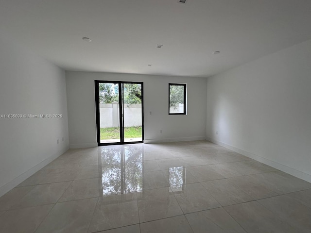 5463 W Oak Way, Dania Beach, FL 33314 - empty room featuring light tile patterned floors and baseboards