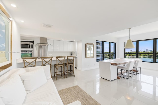 9102 W Bay Harbor Dr Unit 5-D, Bay Harbor Islands, FL 33154 - living area featuring light tile patterned floors and recessed lighting