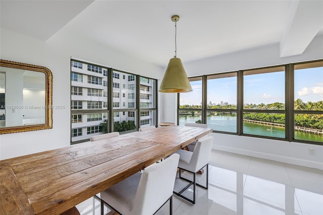9102 W Bay Harbor Dr Unit 5-D, Bay Harbor Islands, FL 33154 - dining area with a water view and tile patterned floors