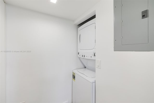 9102 W Bay Harbor Dr Unit 5-D, Bay Harbor Islands, FL 33154 - laundry room featuring estacked washer and dryer and electric panel