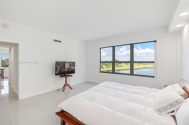 9102 W Bay Harbor Dr Unit 5-D, Bay Harbor Islands, FL 33154 - bedroom featuring light tile patterned floors and baseboards