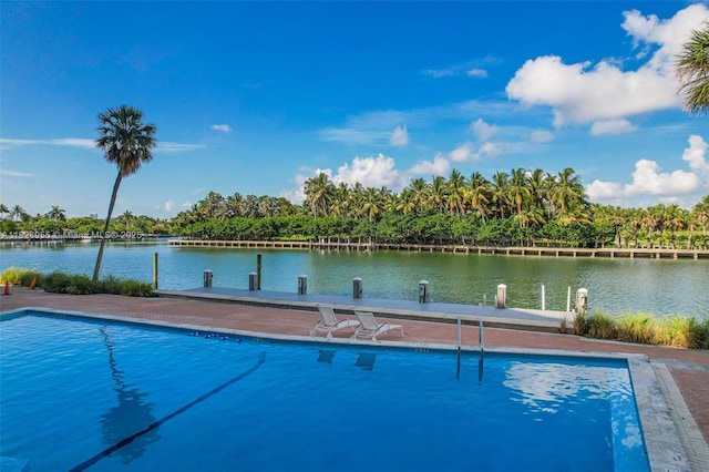 9102 W Bay Harbor Dr Unit 5-D, Bay Harbor Islands, FL 33154 - view of swimming pool with a dock and a water view