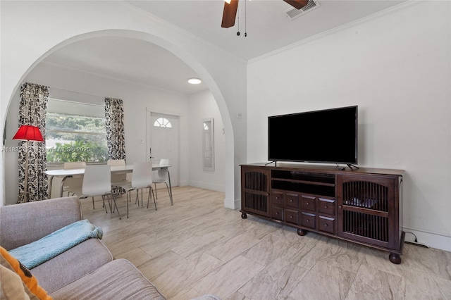 2946 SW 26th St, Miami, FL 33133 - living area with arched walkways, a ceiling fan, and crown molding
