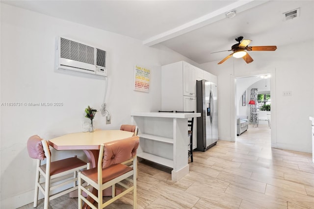 2946 SW 26th St, Miami, FL 33133 - dining area featuring a wall mounted air conditioner, a ceiling fan, beam ceiling, and arched walkways