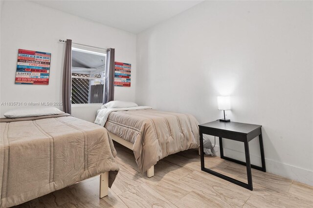 2946 SW 26th St, Miami, FL 33133 - bedroom featuring baseboards