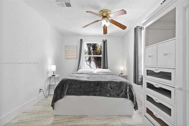 2946 SW 26th St, Miami, FL 33133 - bedroom with a ceiling fan and light marble finish floors